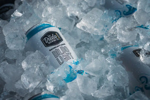 Dildo Light beer cans chilled in a pile of ice, ready to be enjoyed.